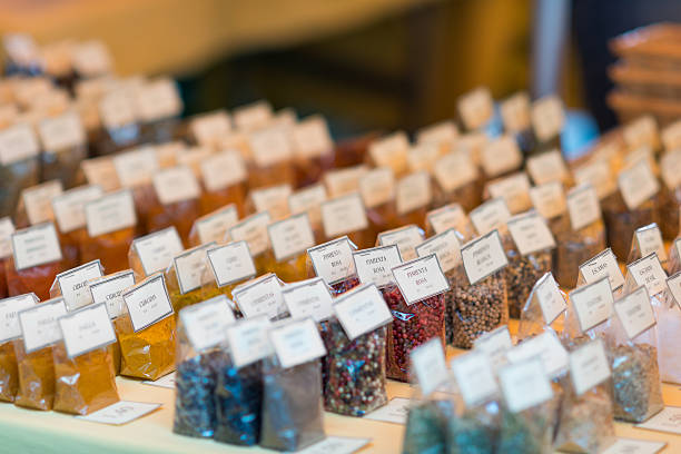 different spice powder packages at a market stall